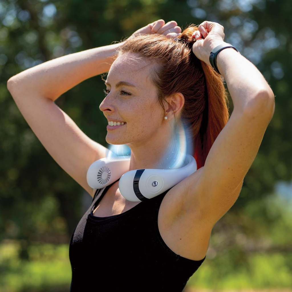 Person staying cool with a portable Sevaros neck fan